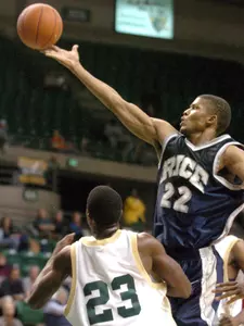 Morris Almond lays in a shot over UAB's Taurus Dortch, during the second half. (AP Photo/The Birmingham News, Mark Almond)