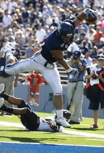 James Casey vaults into the end zone to complete a 26-yard touchdown pass from Chase Clement in the second quarter.