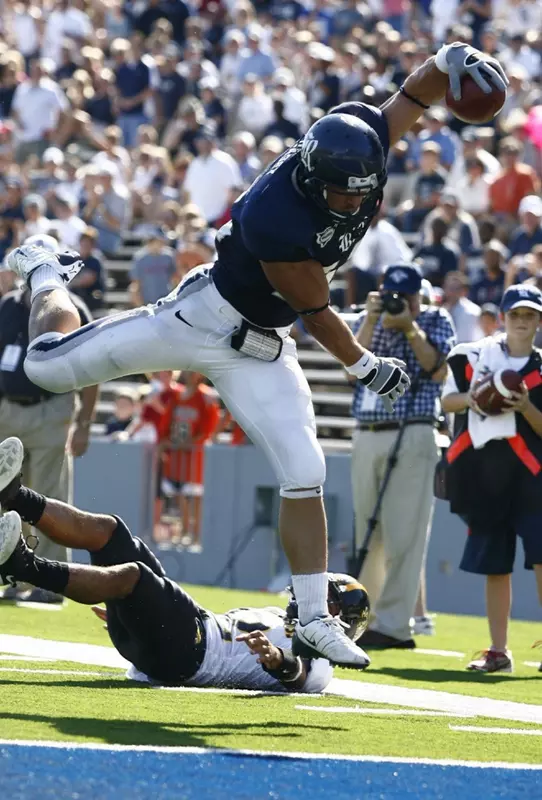 James Casey vaults into the end zone to complete a 26-yard touchdown pass from Chase Clement in the second quarter.