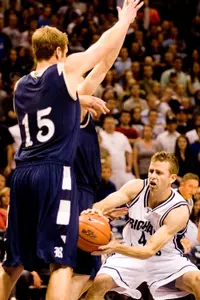 Trey Stanton defends BYU guard Jackson Emery. (AP Photo/The Provo Daily Herald, Davis Archibald)