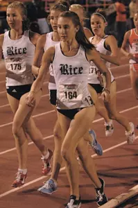 Callie Wells (L), Allison Pye, Nicole Mericle and Becky Wade combined with Marissa Daniels to score 25 points in the 5,000 meters and clinch the team crown for the Owls.