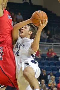 Connor Frizzelle was 5-for-9 from the field and finished with 11 points as the Owls dropped an 84-57 decision to Arizona.