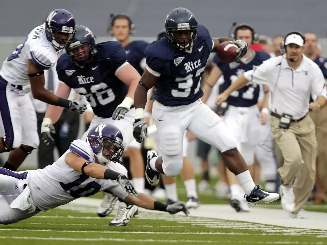 Rice's Tyler Smith breaks away from Northwestern's Brian Peters for more than a 15 yard gain in the second quarter.