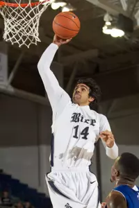 Arsalan Kazemi drives for a first-half dunk against UNO.