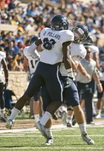 Taylor McHargue and Darrion Pollard celebrate a first-half touchdown at Tulsa.
