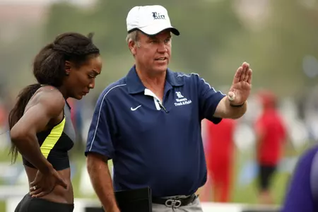 Jim Bevan guides the women's track squad into the home meet.
