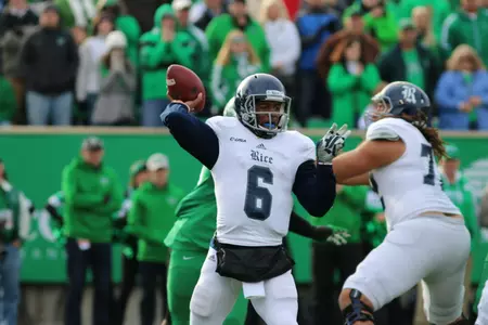 Rice QB prepares to pass the ball downfield.