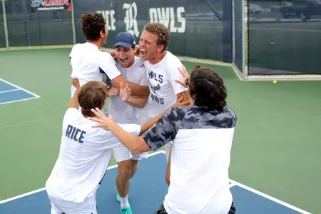 David Warren is mobbed by teammates after clinching the C-USA crown.
