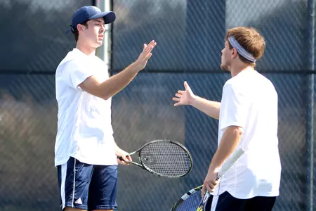 Eric Rutledge and Jake Hansen won twice in doubles and added a win in singles in first day action.