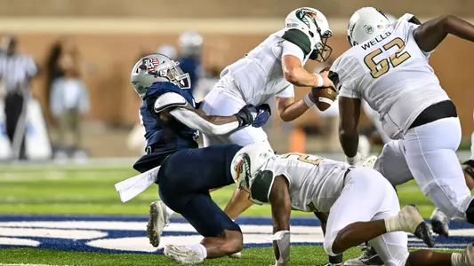 October 01, 2022: Rice Owls linebacker Josh Pearcy (12) sacks UAB Blazers quarterback Dylan Hopkins (9) late in the fourth quarter at Rice Stadium in Houston, Texas. Mandatory Credit: Maria Lysaker | Rice Athletics