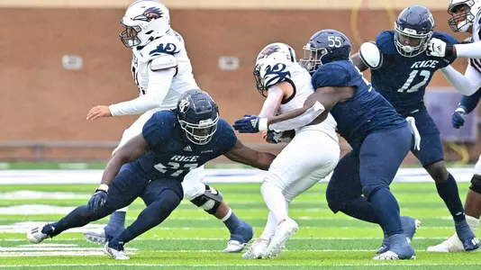 November 19, 2022: Rice Owls linebacker Andrew Awe (27) tackles UTSA Roadrunners running back Justin Rodriguez (21) during the game at Rice Stadium in Houston, Texas. Mandatory Credit: Maria Lysaker | Rice Athletics