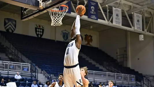 October 31, 2022: Rice Owls center Ifeanyi Ufochukwu (11) slam dunks the ball during the second half against the Rockhurst Hawks at Tudor Fieldhouse in Houston, Texas. Mandatory Credit: Maria Lysaker | Rice Athletics