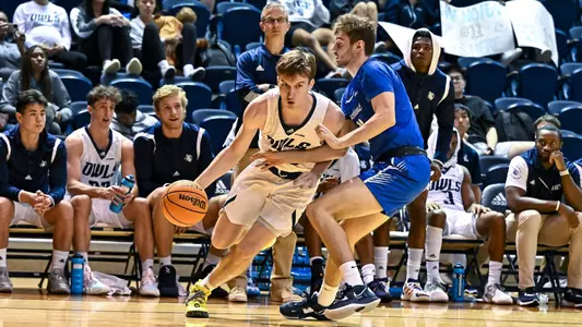 October 31, 2022: Rice Owls guard Jackson Peakes (22) drives to the basket second half against the Rockhurst Hawks at Tudor Fieldhouse in Houston, Texas. Mandatory Credit: Maria Lysaker | Rice Athletics