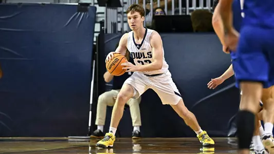 October 31, 2022:  Rice Owls guard Jackson Peakes (22) dribbles the ball during the second half against the Rockhurst Hawks at Tudor Fieldhouse in Houston, Texas. Mandatory Credit: Maria Lysaker | Rice Athletics