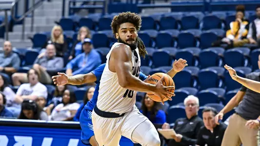 October 31, 2022: Rice Owls guard Mason Jones (10) controls the ball during the first half against the Rockhurst Hawks at Tudor Fieldhouse in Houston, Texas. Mandatory Credit: Maria Lysaker | Rice Athletics