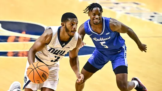October 31, 2022: Rice Owls guard Travis Evee (3) fakes a drive to the basket and passes the ball during the first half against the Rockhurst Hawks at Tudor Fieldhouse in Houston, Texas. Mandatory Credit: Maria Lysaker | Rice Athletics