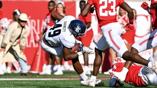September 10, 2022: Rice Owls fullback Micah Barnett (49) on the carry during the first quarter of the Bayou Bucket Classic against the Houston Cougars at TDECU Stadium in Houston, Texas.   (Mandatory Credit: Maria Lysaker | Rice Athletics)