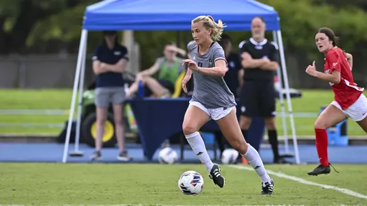 August 21, 2022, Houston, Texas, USA; Rice Owls forward Grace Collins (9) in action during the match against the Samford Bulldogs at Holloway Field Rice University.  (Mandatory Credit:  Maria Lysaker | Rice Athletics)