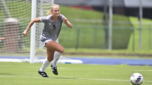 August 21, 2022, Houston, Texas, USA; Rice Owls forward Grace Collins (9) in action during the match against the Samford Bulldogs at Holloway Field Rice University.  (Mandatory Credit:  Maria Lysaker | Rice Athletics)
