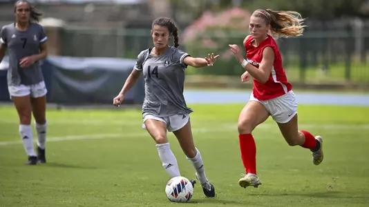 August 21, 2022, Houston, Texas, USA; Rice Owls midfielder Mikala Furuto (14) in action during the match against the Samford Bulldogs at Holloway Field Rice University.  (Mandatory Credit:  Maria Lysaker | Rice Athletics)