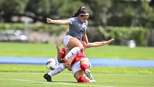 August 21, 2022, Houston, Texas, USA;  Rice Owls forward Jules Johnston (25) battles for possession during the match against Samford Bulldogs at Holloway Field Rice University.  (Mandatory Credit:  Maria Lysaker | Rice Athletics)