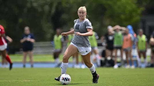 August 21, 2022, Houston, Texas, USA; Rice Owls midfielder Kenna Sanders (18) in action during the match against the Samford Bulldogs at Holloway Field Rice University.  (Mandatory Credit:  Maria Lysaker | Rice Athletics)