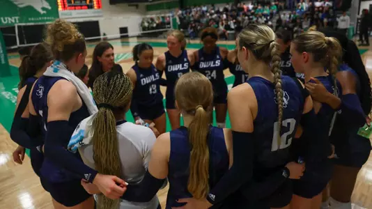 Rice volleyball huddles during a timeout of a recent match