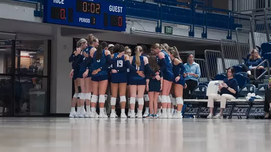 Rice volleyball huddles up during a recent match