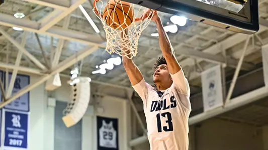 December 15, 2022:  Rice Owls forward Andrew Akuchie (13) dunks the ball against the North American Stallions during the second half at Tudor Fieldhouse in Houston, Texas. Mandatory Credit: Maria Lysaker | Rice Athletics