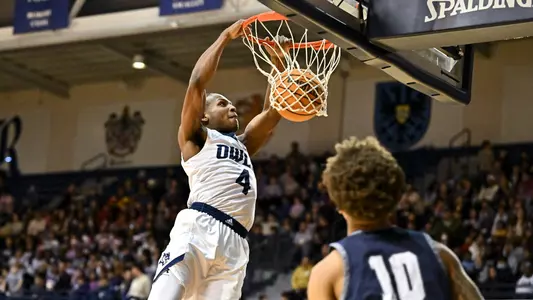 December 15, 2022:  Rice Owls guard Quincy Olivari (4) slam dunks the ball against the North American Stallions during the first half at Tudor Fieldhouse in Houston, Texas. Mandatory Credit: Maria Lysaker | Rice Athletics