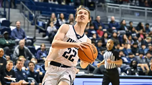 December 15, 2022: Rice Owls guard Jackson Peakes (22) shoots the ball against the North American Stallions during the second half at Tudor Fieldhouse in Houston, Texas. Mandatory Credit: Maria Lysaker | Rice Athletics