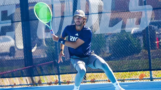 Men's tennis senior Yasha Zemel hits a return shot in a recent match