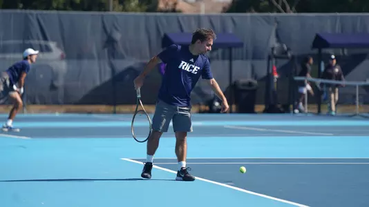 Men's tennis player Emir Sendogan readies to serve during a recent match