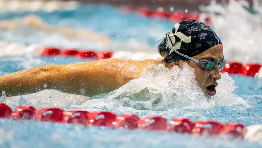 A Rice swimmer competes in a butterfly event at a recent meet