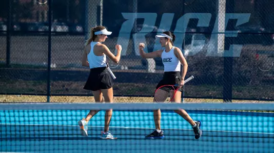 Rice women's tennis players Chie Kezuka and Federica Trevisan celebrate after a point during a recent doubles match