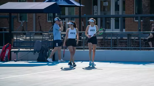 Rice women's tennis players Chie Kezuka (left) and Federica Trevisan (right) walk back to the service line in between play of a recent match