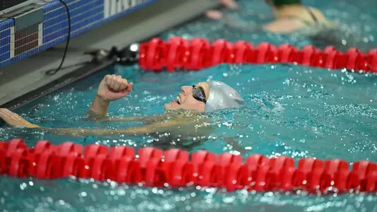 Rice swimmer Imogen Meers celebrates after winning an event at the 2024 AAC Championships