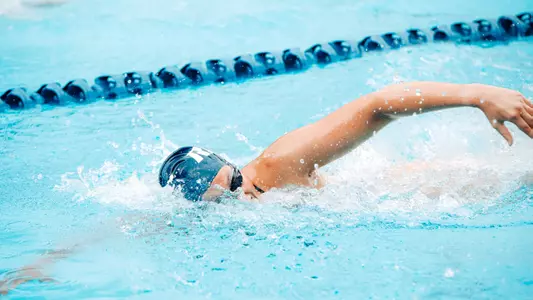 A Rice swimmer competes in a freestyle event at a recent meet