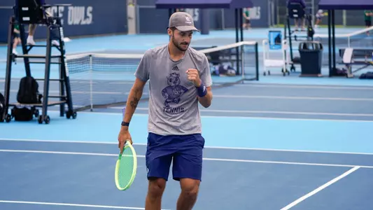 Rice men's tennis player Yasha Zemel pumps his fist after a point during a recent match