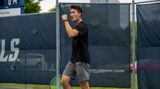Rice men's tennis player Petro Kuzmenok celebrates after scoring a point during a recent match