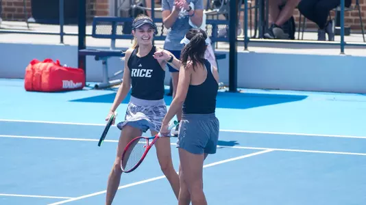 Rice women's tennis players Federica Trevisan and Chie Kezuka celebrate after winning a point during a recent doubles match