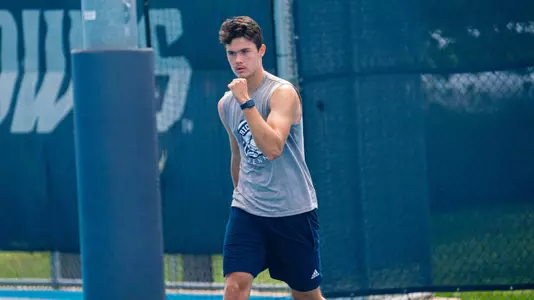 Rice men's tennis player Petro Kuzmenok celebrates a point during a recent match