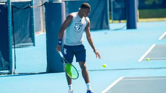 Rice men's tennis player Trinity Grear prepares to serve during a recent match