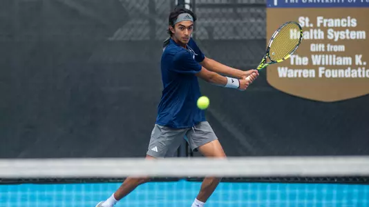 Rice men's tennis player Kabeer Kapasi returns a shot during a match at the 2024 AAC Championships