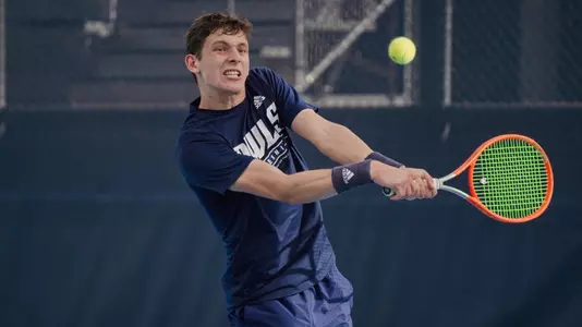 Rice men's tennis player Arthus de la Bassetiere returns a serve during a recent practice