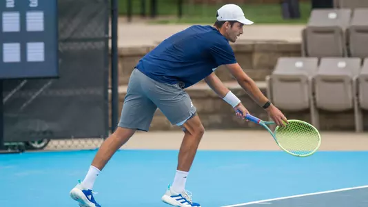 Rice men's tennis player Yasha Zemel prepares to serve during a match at the 2024 AAC Championships