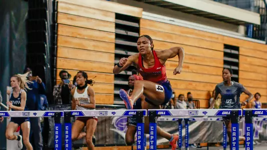 Kamryn Ross competes in the 60m hurdles at the CNU Holiday Open on Dec. 5, 2021. Ross won the event with a time of 8.90