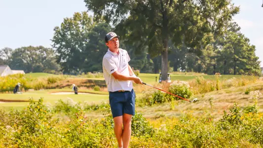 Lou Baker stares down his tee shot