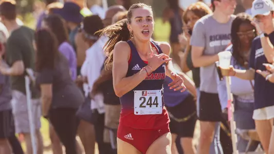 Elizabeth Stockman crossing the finish line with no one around her