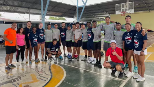 Spider student-athletes pose with local high school students and sport administrators in Costa Rica